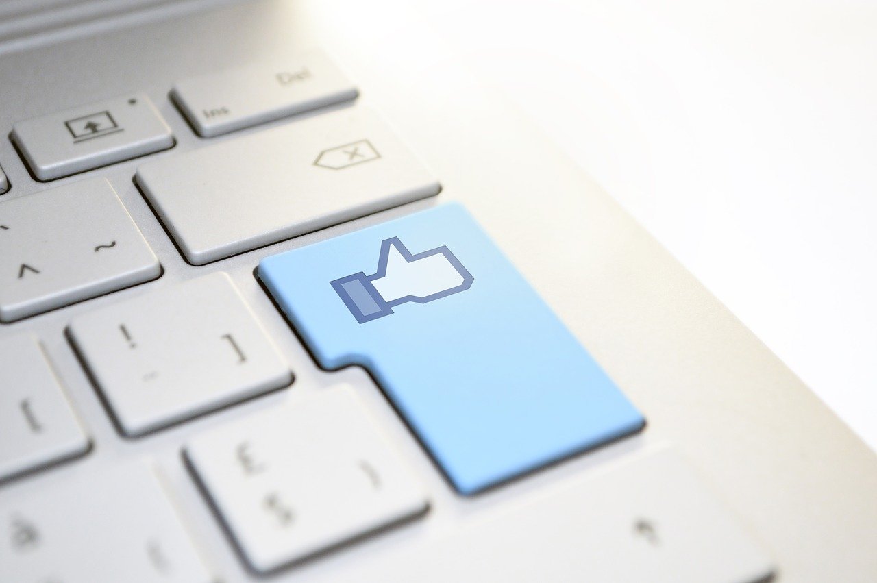 Facebook like thumbs up on computer keyboard